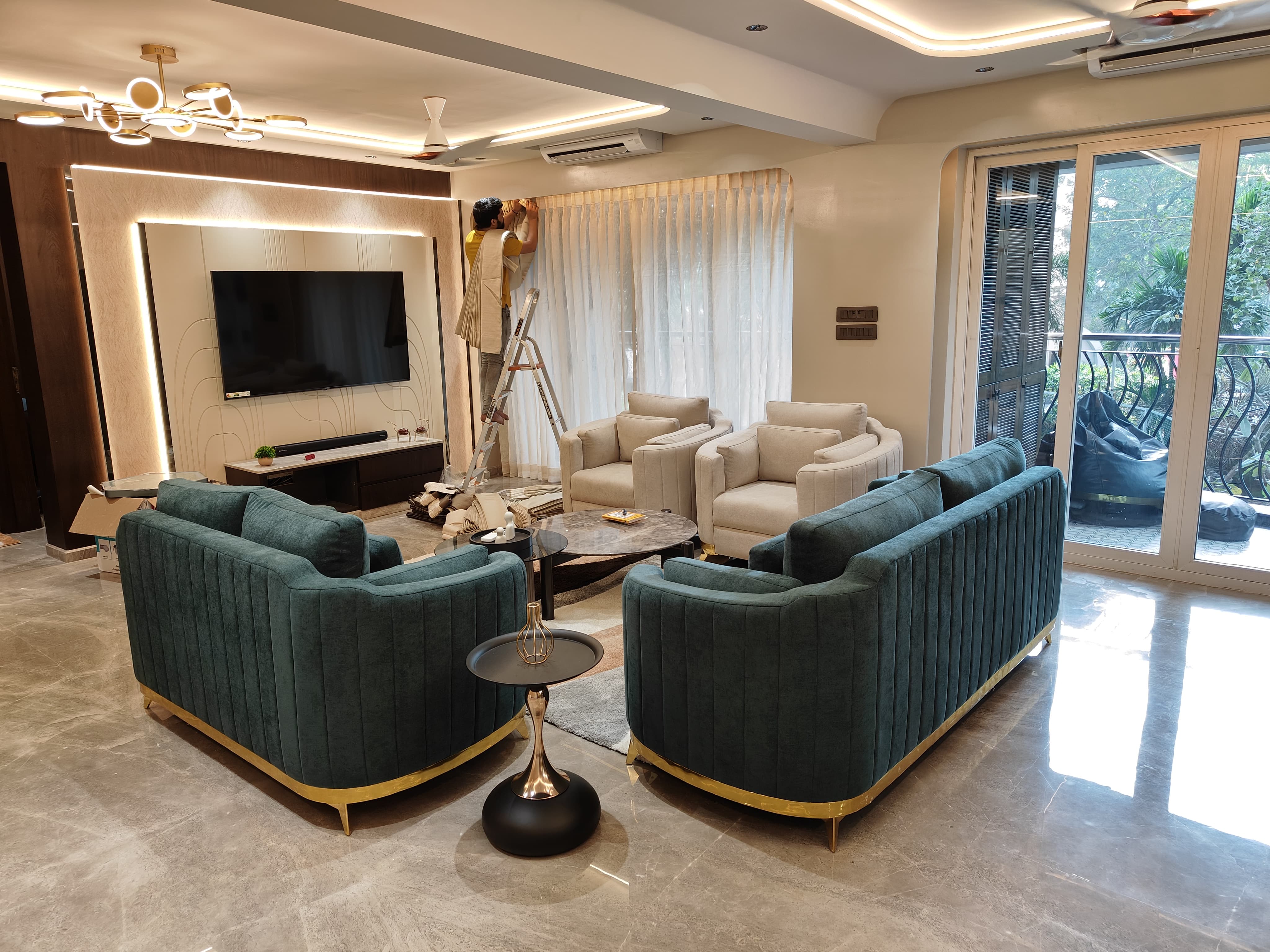 Emerald green velvet sofa set with cream armchairs